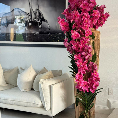 Large teak vase with natural edges and pink Vanda orchids